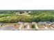 Aerial view of a residential area backing up to a green space and roads at 704 Chelsea Ave, Fruitland Park, FL 34731