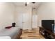 Bedroom featuring neutral walls, wood-look floors, and modern furnishing at 704 Chelsea Ave, Fruitland Park, FL 34731