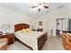 Bright bedroom showcasing neutral walls and a ceiling fan at 704 Chelsea Ave, Fruitland Park, FL 34731