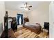 Bedroom featuring modern desk, furnishings, and natural light from the window at 704 Chelsea Ave, Fruitland Park, FL 34731