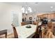 Dining area open to the living room and kitchen provides an open concept feel at 704 Chelsea Ave, Fruitland Park, FL 34731