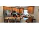 Well-equipped kitchen featuring stainless steel appliances, granite countertops, and ample cabinet space at 704 Chelsea Ave, Fruitland Park, FL 34731