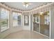 Inviting breakfast nook with a view of the sunroom and backyard at 705 Grand Vista Trl, Leesburg, FL 34748