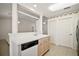 Well-lit kitchen with bright cabinets, a dishwasher, and an open layout at 705 Grand Vista Trl, Leesburg, FL 34748