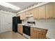 Functional kitchen featuring matching appliances and cabinetry at 705 Grand Vista Trl, Leesburg, FL 34748