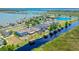 An aerial view of a waterfront community featuring homes with docks on a beautiful lake at 722 Barefoot Bay Loop, Groveland, FL 34736