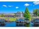 Aerial view showcasing the home with boat dock, waterfront access, and screened in pool at 722 Barefoot Bay Loop, Groveland, FL 34736