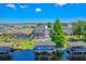 Waterfront home featuring a private dock, boat lift, screened lanai and an in-ground pool at 722 Barefoot Bay Loop, Groveland, FL 34736