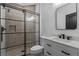 Modern bathroom featuring a walk-in shower with a glass enclosure, sleek fixtures, and elegant tile work at 722 Barefoot Bay Loop, Groveland, FL 34736