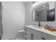Modern bathroom with sleek vanity, herringbone-patterned shower, and elegant fixtures at 722 Barefoot Bay Loop, Groveland, FL 34736