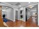 Hallway featuring archways, stylish decor, and seamless transitions to adjacent rooms at 722 Barefoot Bay Loop, Groveland, FL 34736