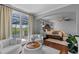 Bright main bedroom featuring sitting area, hardwood floors, large windows with scenic views and vaulted ceilings at 722 Barefoot Bay Loop, Groveland, FL 34736