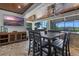 Inviting outdoor living area featuring a large table and chairs, ideal for dining and entertaining at 722 Barefoot Bay Loop, Groveland, FL 34736