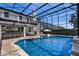 Beautiful pool with in-pool loungers, screened enclosure and an outdoor bar area creating a resort-like experience at 722 Barefoot Bay Loop, Groveland, FL 34736