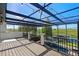 Spacious screened patio overlooking pool with string lights perfect for outdoor entertaining or relaxation at 722 Barefoot Bay Loop, Groveland, FL 34736
