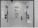 Modern shower with dual shower heads, glass enclosure and tiled walls creating a spa-like experience at 722 Barefoot Bay Loop, Groveland, FL 34736