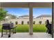 Covered back patio with grill overlooking manicured fenced backyard at 743 Brooks Field Drive Dr, Winter Garden, FL 34787