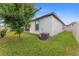 Well-maintained backyard with green grass, privacy fence, and mature tree at 743 Brooks Field Drive Dr, Winter Garden, FL 34787