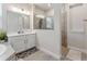 Bathroom featuring double sinks, glass shower, and tile floors at 743 Brooks Field Drive Dr, Winter Garden, FL 34787