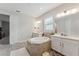 Bright bathroom with large tub, double sinks, and neutral tile at 743 Brooks Field Drive Dr, Winter Garden, FL 34787