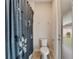 Bright bathroom with toilet, shower with floral curtain, and tiled floors at 743 Brooks Field Drive Dr, Winter Garden, FL 34787