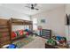 Cozy bedroom with bunk beds, a ceiling fan, and carpet flooring at 743 Brooks Field Drive Dr, Winter Garden, FL 34787