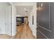 Open entryway flowing into a living space with wood floors and a glimpse of stylish interior design at 743 Brooks Field Drive Dr, Winter Garden, FL 34787