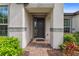 Inviting entrance featuring a black front door, brick pathway, and colorful landscaping accents at 743 Brooks Field Drive Dr, Winter Garden, FL 34787