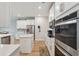 Open kitchen with stainless appliances, an island and pendant lighting at 743 Brooks Field Drive Dr, Winter Garden, FL 34787