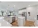 Spacious kitchen featuring white cabinets, stainless appliances, and an island with a sink at 743 Brooks Field Drive Dr, Winter Garden, FL 34787
