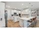 Bright, open-concept kitchen with an island, bar seating, and stainless steel appliances at 743 Brooks Field Drive Dr, Winter Garden, FL 34787