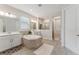 Large primary bathroom featuring a soaking tub, double vanities, a shower, and tile floors at 743 Brooks Field Drive Dr, Winter Garden, FL 34787