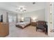 Spacious bedroom with neutral décor, a ceiling fan, and large window for natural light at 743 Brooks Field Drive Dr, Winter Garden, FL 34787