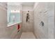 Tiled shower with built-in niche and glass partition at 743 Brooks Field Drive Dr, Winter Garden, FL 34787