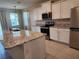 Well-equipped kitchen with granite countertops, stainless appliances and ample storage at 7974 Penrose Pl, Wildwood, FL 34785