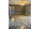 Spacious living room featuring wood floors and neutral colored walls at 808 Chamberlain Loop, Lake Wales, FL 33853