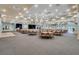 Large ballroom venue with a stage, dance floor, and numerous tables set for a special event at 8387 Bridgeport Bay Cir, Mount Dora, FL 32757