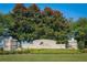 Lakes of Mount Dora Community Sign with lush trees and landscaping at 8387 Bridgeport Bay Cir, Mount Dora, FL 32757