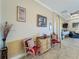 Inviting foyer with tile floors and charming decor leads into the home's living spaces at 8387 Bridgeport Bay Cir, Mount Dora, FL 32757