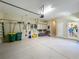 View of a spacious, clean garage with ample storage and organization at 8387 Bridgeport Bay Cir, Mount Dora, FL 32757
