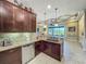 Kitchen featuring stainless steel appliances, granite countertops, plenty of cabinets, and modern decor at 8387 Bridgeport Bay Cir, Mount Dora, FL 32757