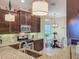 Well-equipped kitchen features stainless steel appliances, granite counters, and breakfast nook at 8387 Bridgeport Bay Cir, Mount Dora, FL 32757