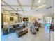 Expansive living room seamlessly connects to dining area with open floor plan at 8387 Bridgeport Bay Cir, Mount Dora, FL 32757