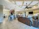 Spacious open-concept living room with access to kitchen and outdoor area at 8387 Bridgeport Bay Cir, Mount Dora, FL 32757