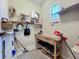 View of the utility room with a sturdy workbench at 8387 Bridgeport Bay Cir, Mount Dora, FL 32757