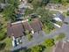 Overhead view of the property showcasing its location, landscaping, community, driveway, and surrounding neighborhood streets at 903 Belle Oak Dr, Leesburg, FL 34748