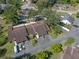 Overhead view of the property showcasing its location, landscaping, community, driveway, and surrounding neighborhood streets at 903 Belle Oak Dr, Leesburg, FL 34748