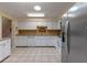 Large kitchen with modern appliances, stone countertops and ample cabinet space at 903 Belle Oak Dr, Leesburg, FL 34748