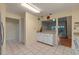 Spacious kitchen with tile flooring, abundant cabinet space, and a breakfast bar at 903 Belle Oak Dr, Leesburg, FL 34748