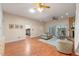 Open concept living room with hardwood flooring, bright lighting, and neutral decor at 903 Belle Oak Dr, Leesburg, FL 34748